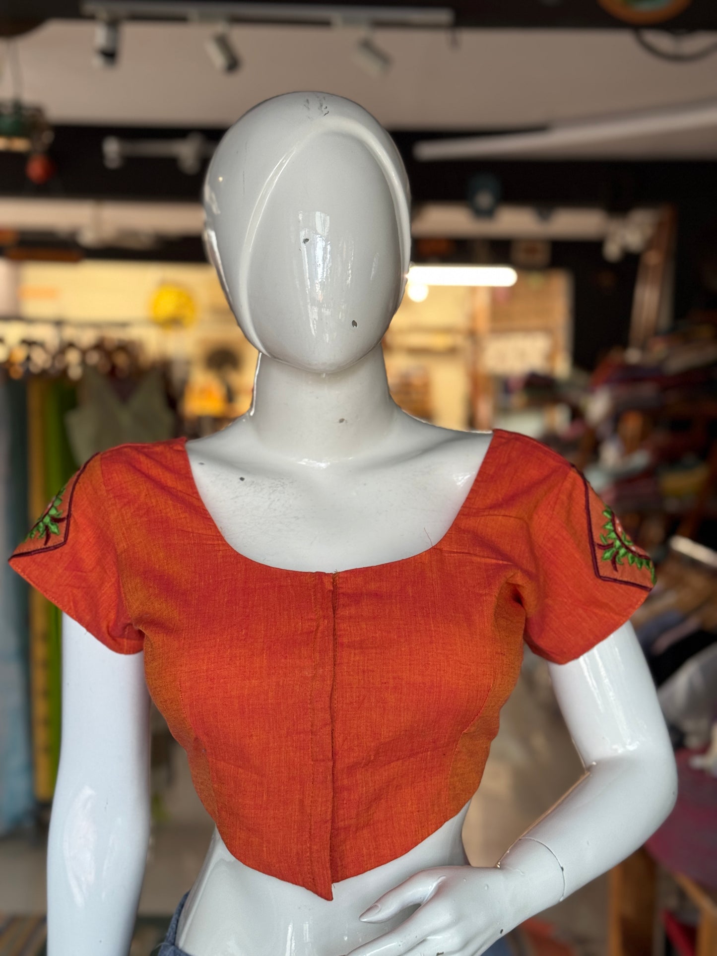 Orange cotton blouse with  embroidered patches on the back and sleeves