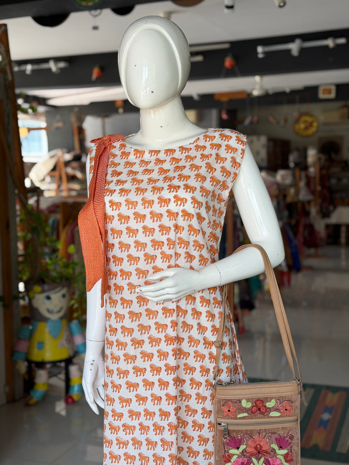 White n Orange cotton dress with horses hand block prints and handwoven 4 pedal weave trims