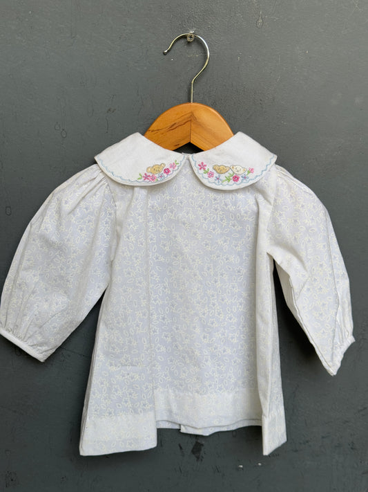 White embroidered Peter Pan collared cotton baby frock with cute embroidery