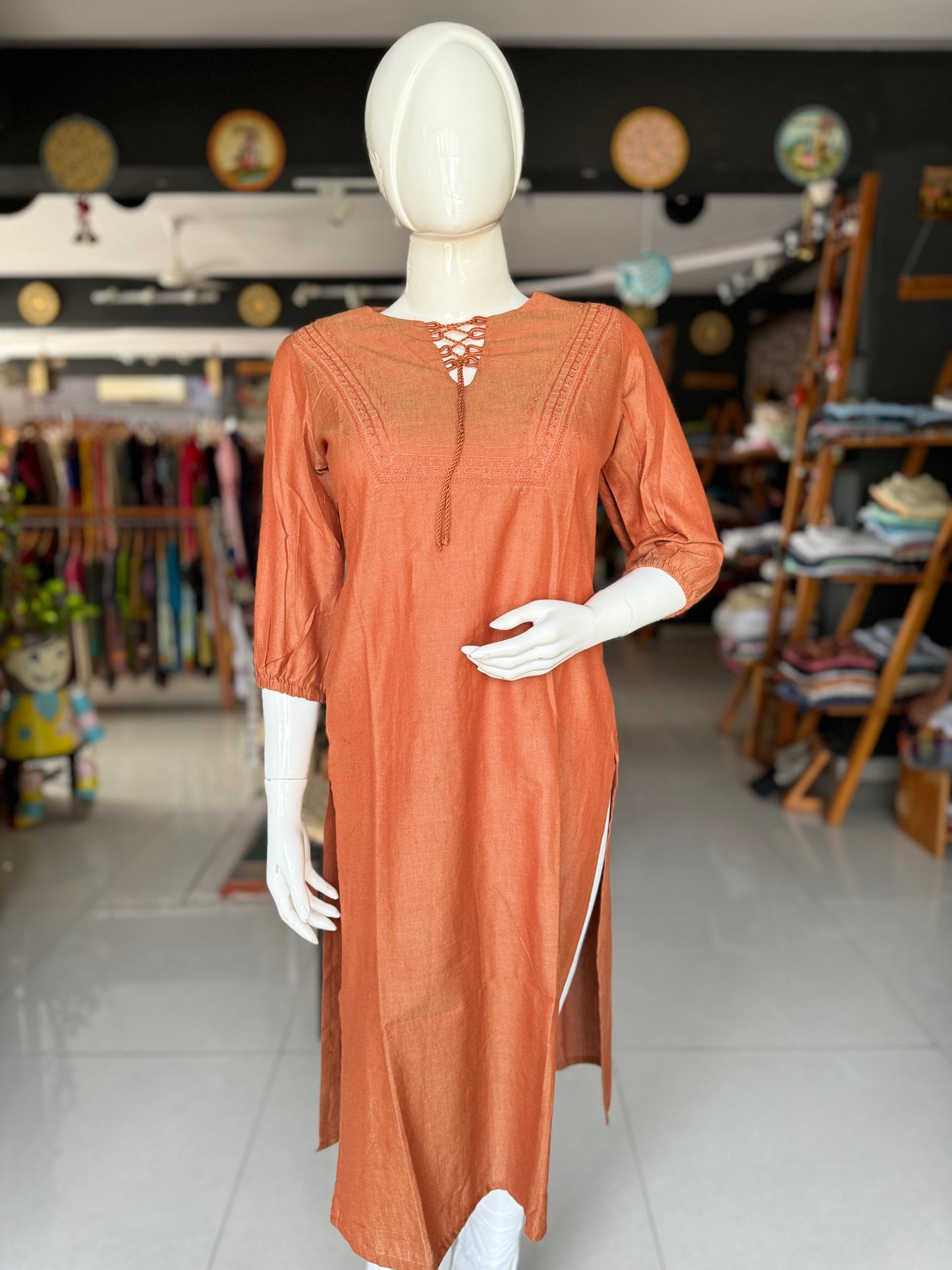 Rust brown cotton kurti with hand embroidery on yoke and tie up dori for neck placket