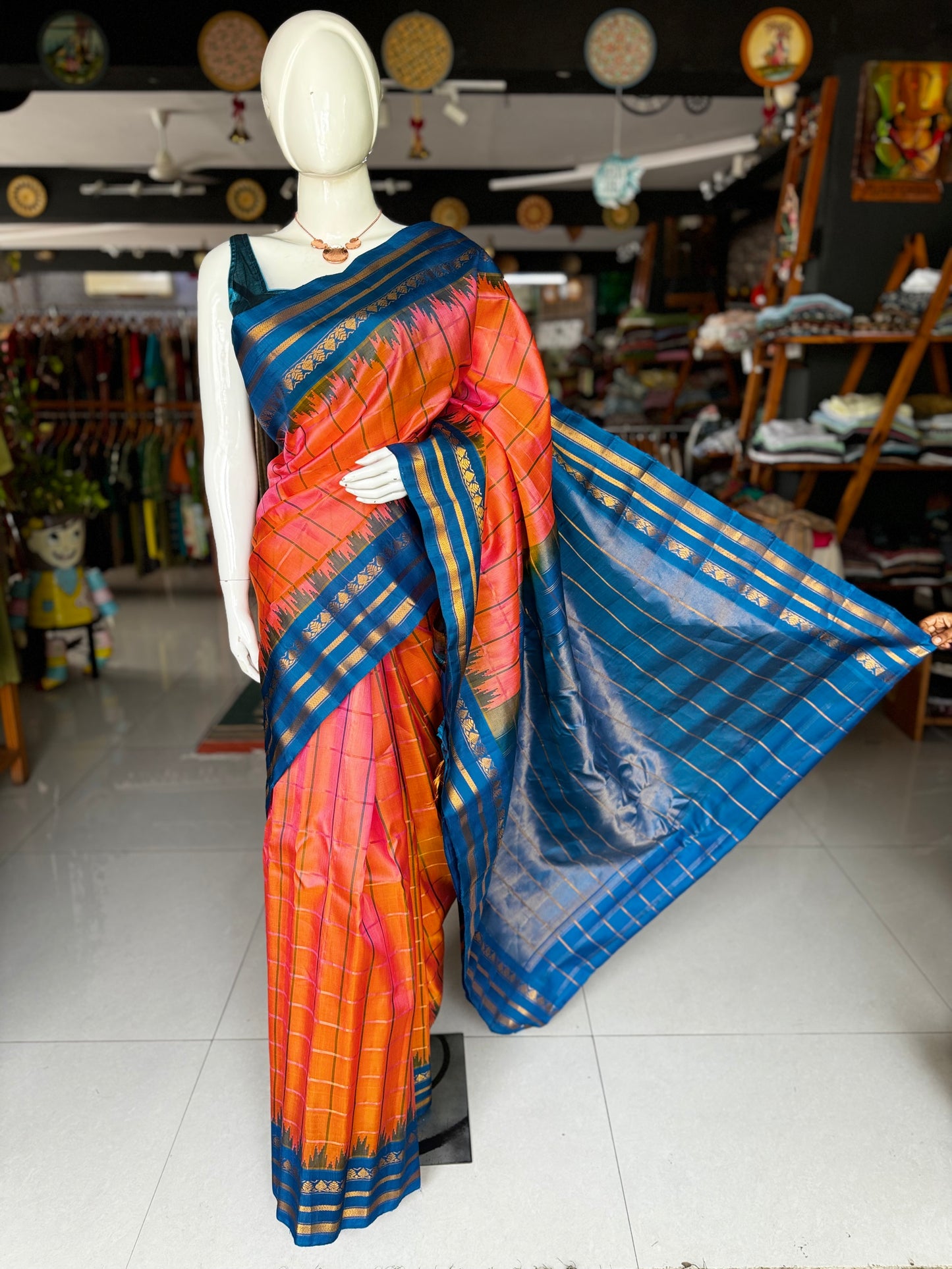 Peach and blue pure silk handwoven Gadwal checks saree with temple border