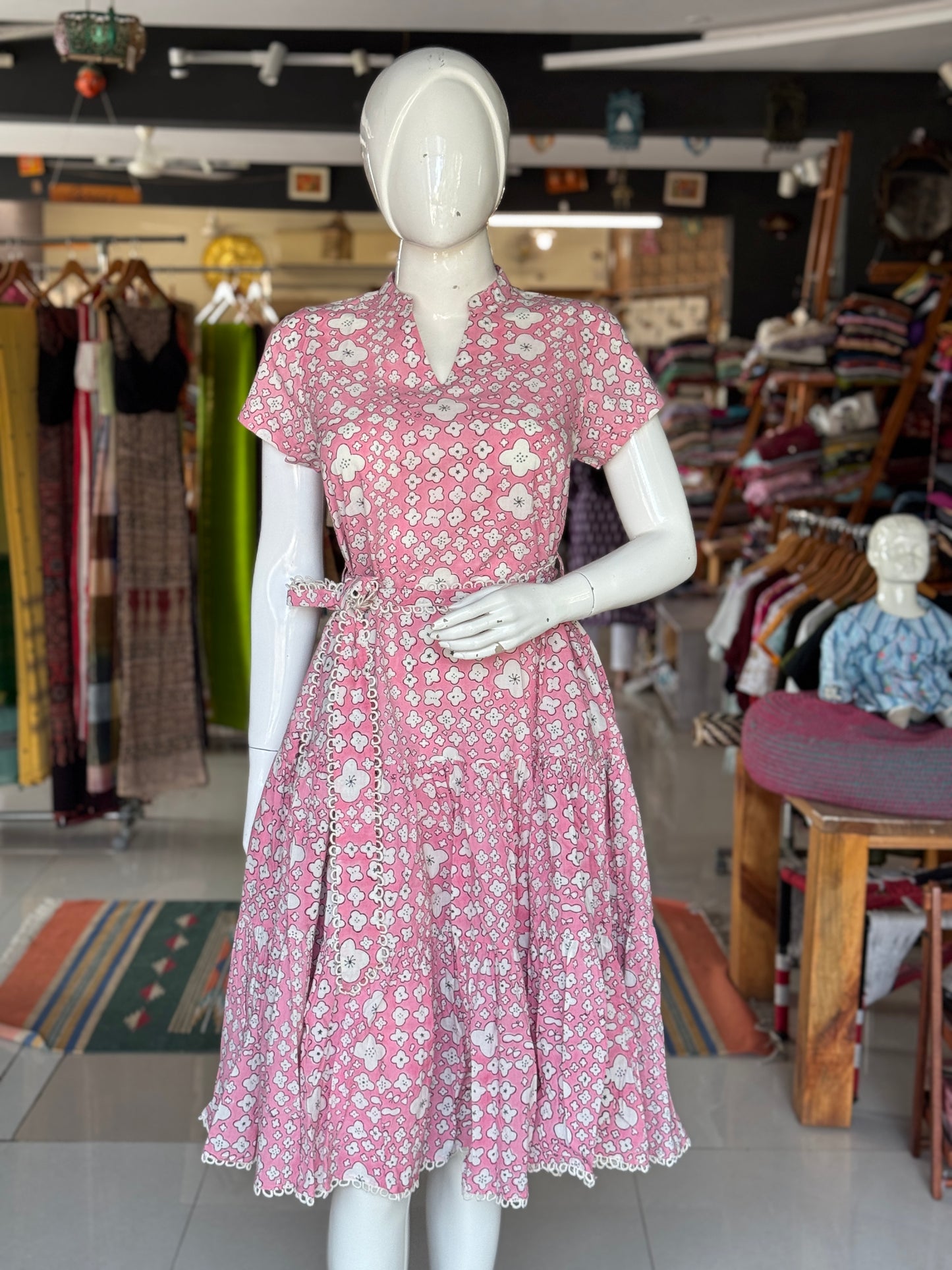 Pink cotton hand block printed tiered dress with belt and lace detailing