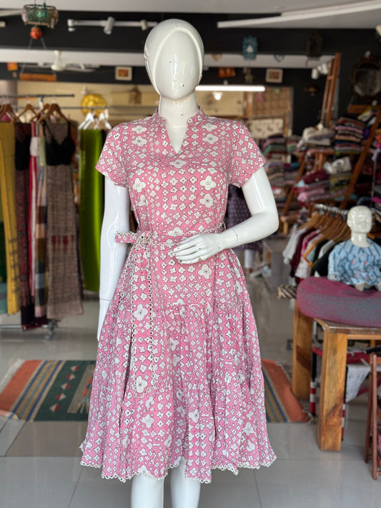 Pink cotton hand block printed tiered dress with belt and lace detailing