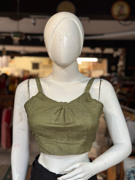 Green silk blouse with strap sleeves and front gathers