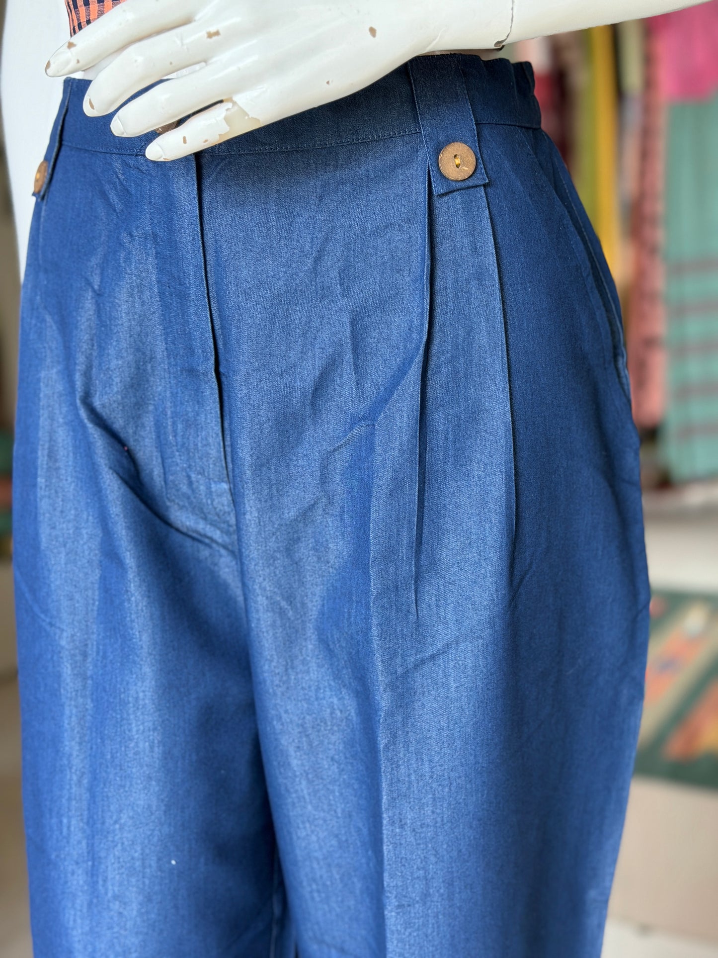 Blue cotton denim pleated pants with buttons detailing