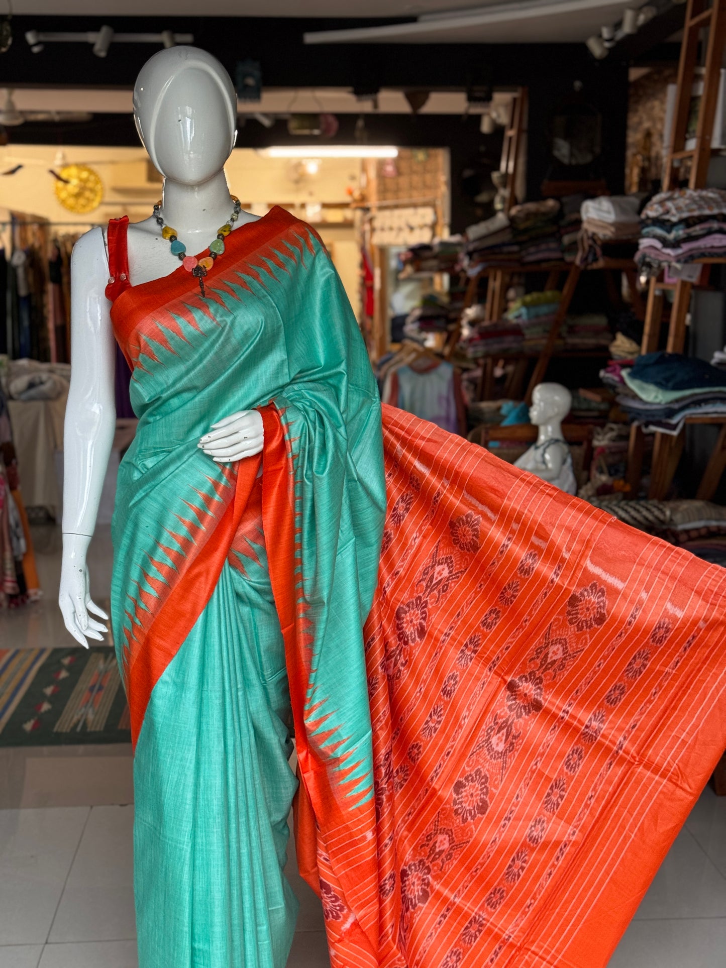 Sea green and orange tussar handwoven saree with ikat palla