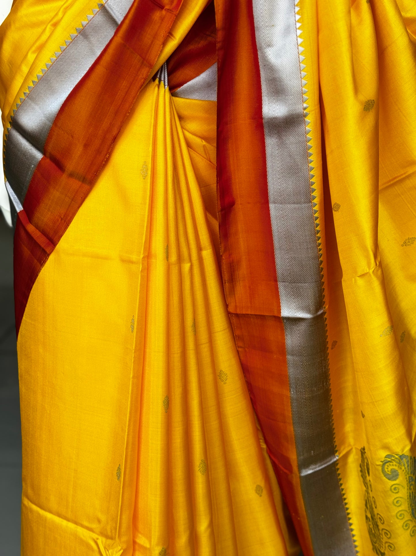 Haldi yellow pure silk Kodiyala handloom saree with all over gold butis and silver katan border