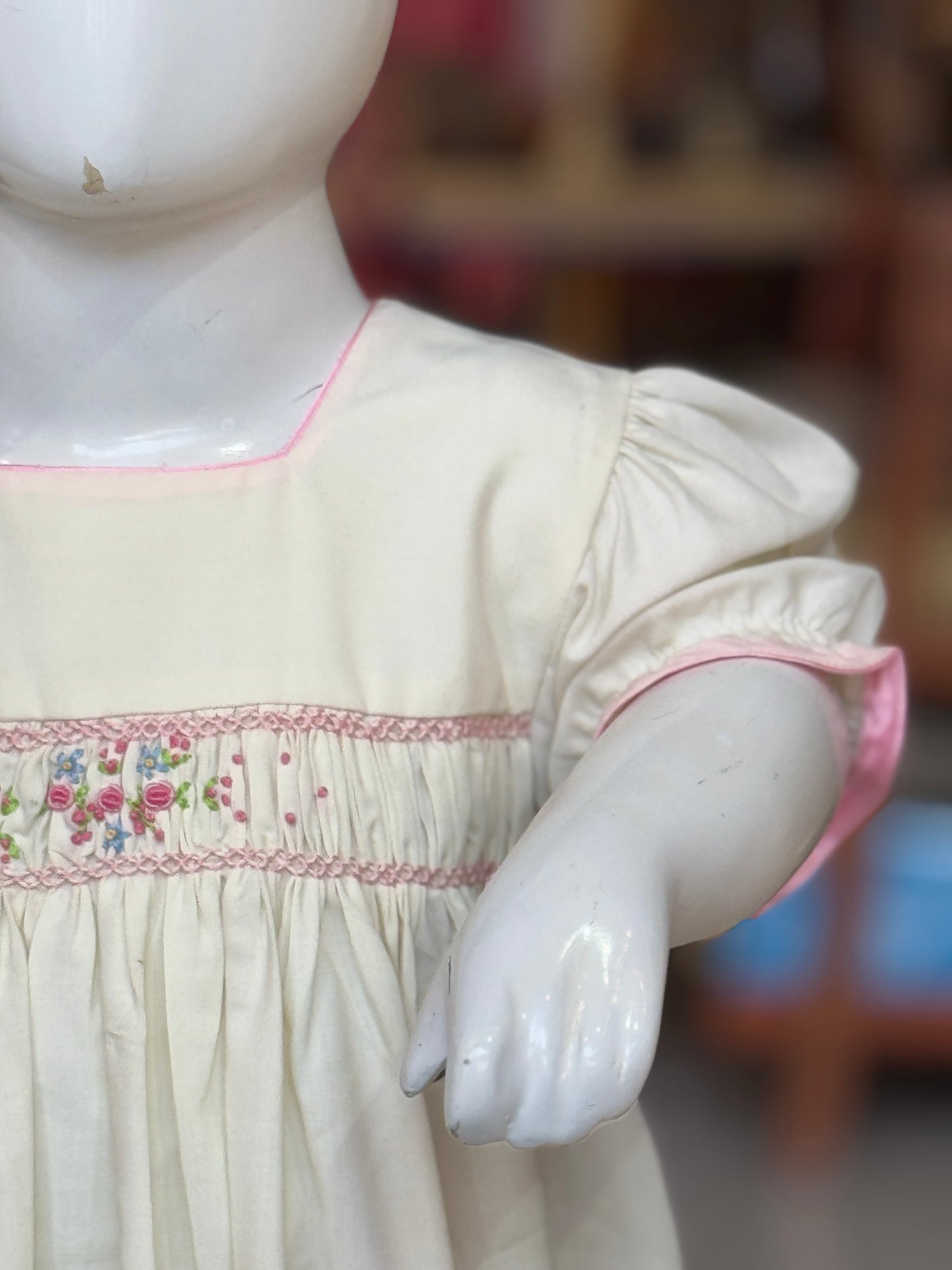 Cream smocking square neck cotton frock with hand embroidery and pink trims