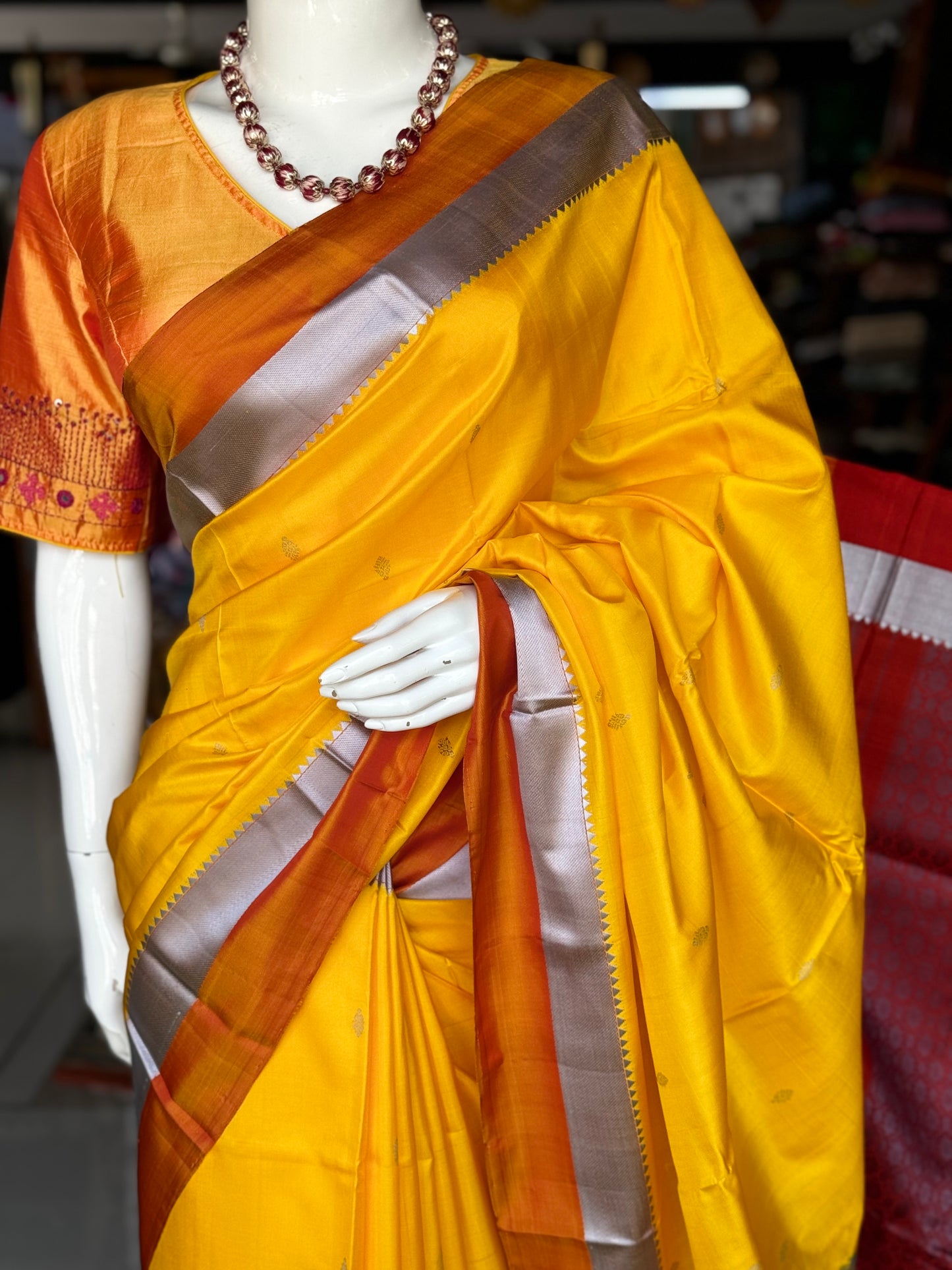 Haldi yellow pure silk Kodiyala handloom saree with all over gold butis and silver katan border