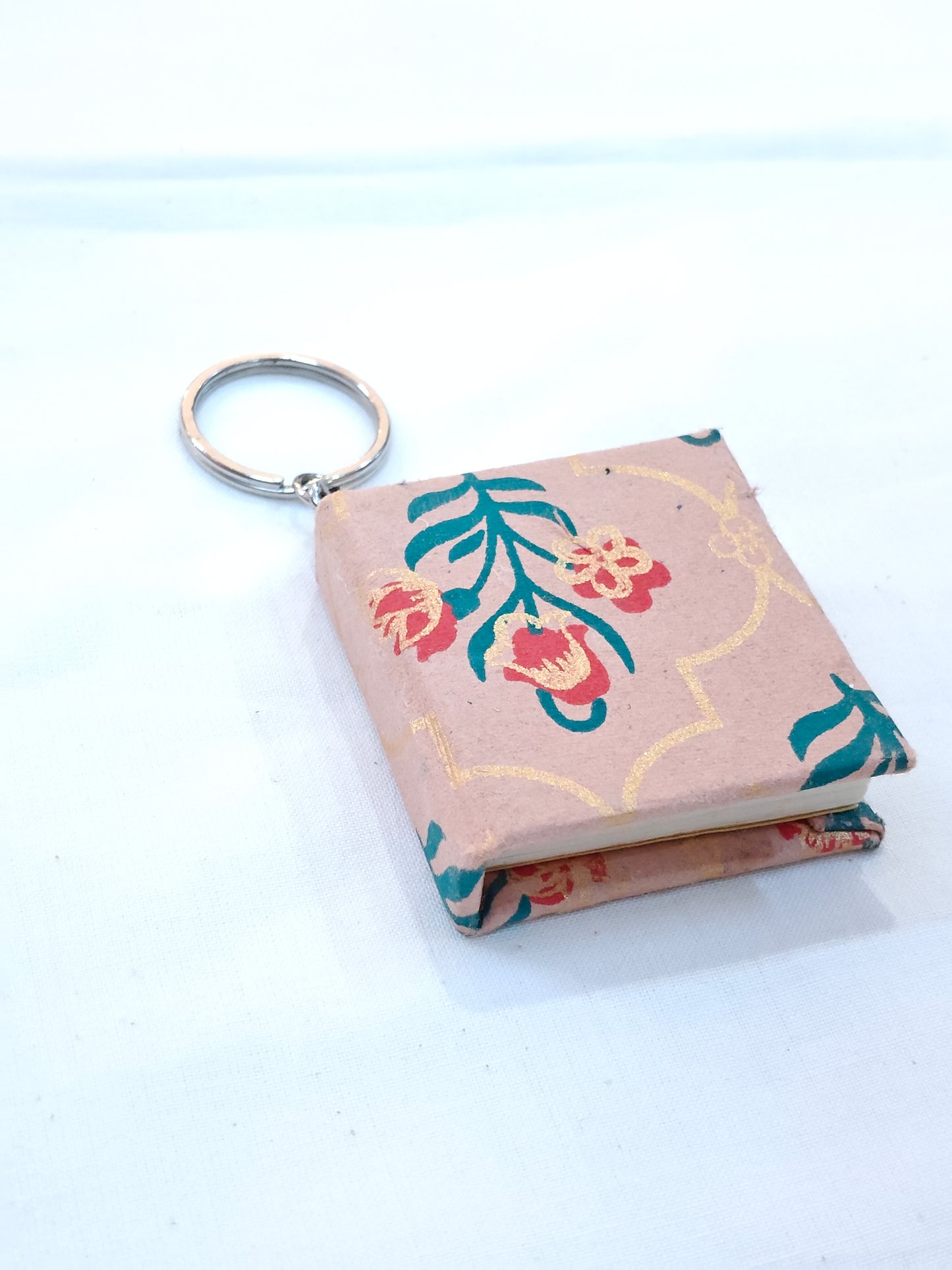 Key ring with small hand made paper notebook