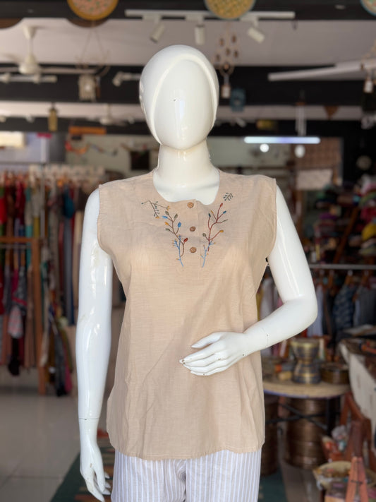 Beige cotton sleeveless short top with hand embroidery for yoke