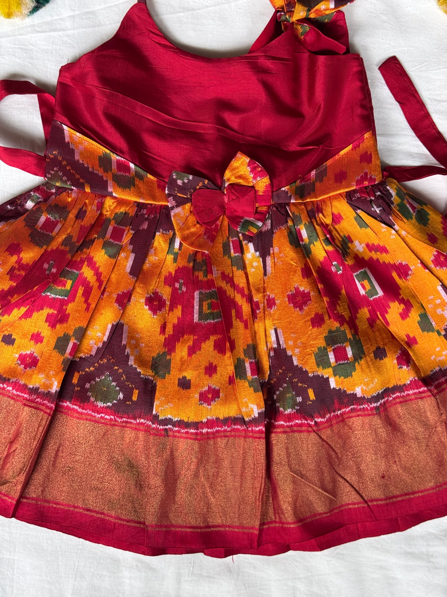 Yellow n maroon pure silk ikat hand woven frock for baby girl