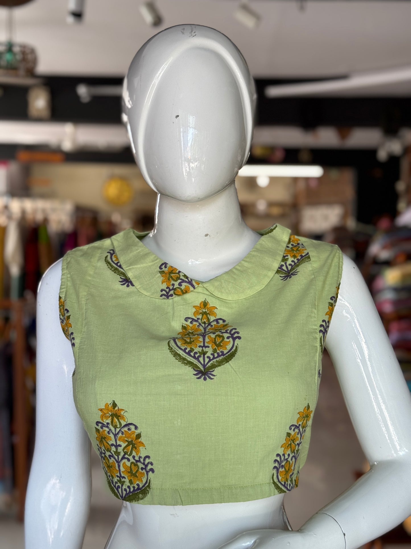 Green collared sleeveless handblock printed cotton back open blouse