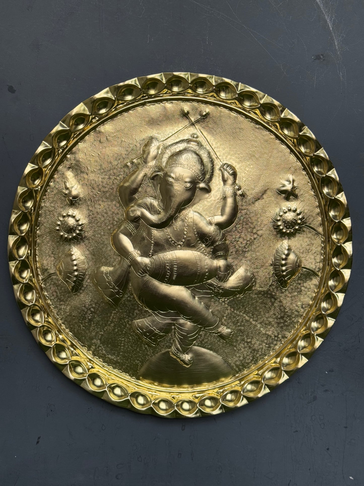 Ganesha in dancing pose - Brass handcrafted round wall plate - traditional embossed Chamba thaal