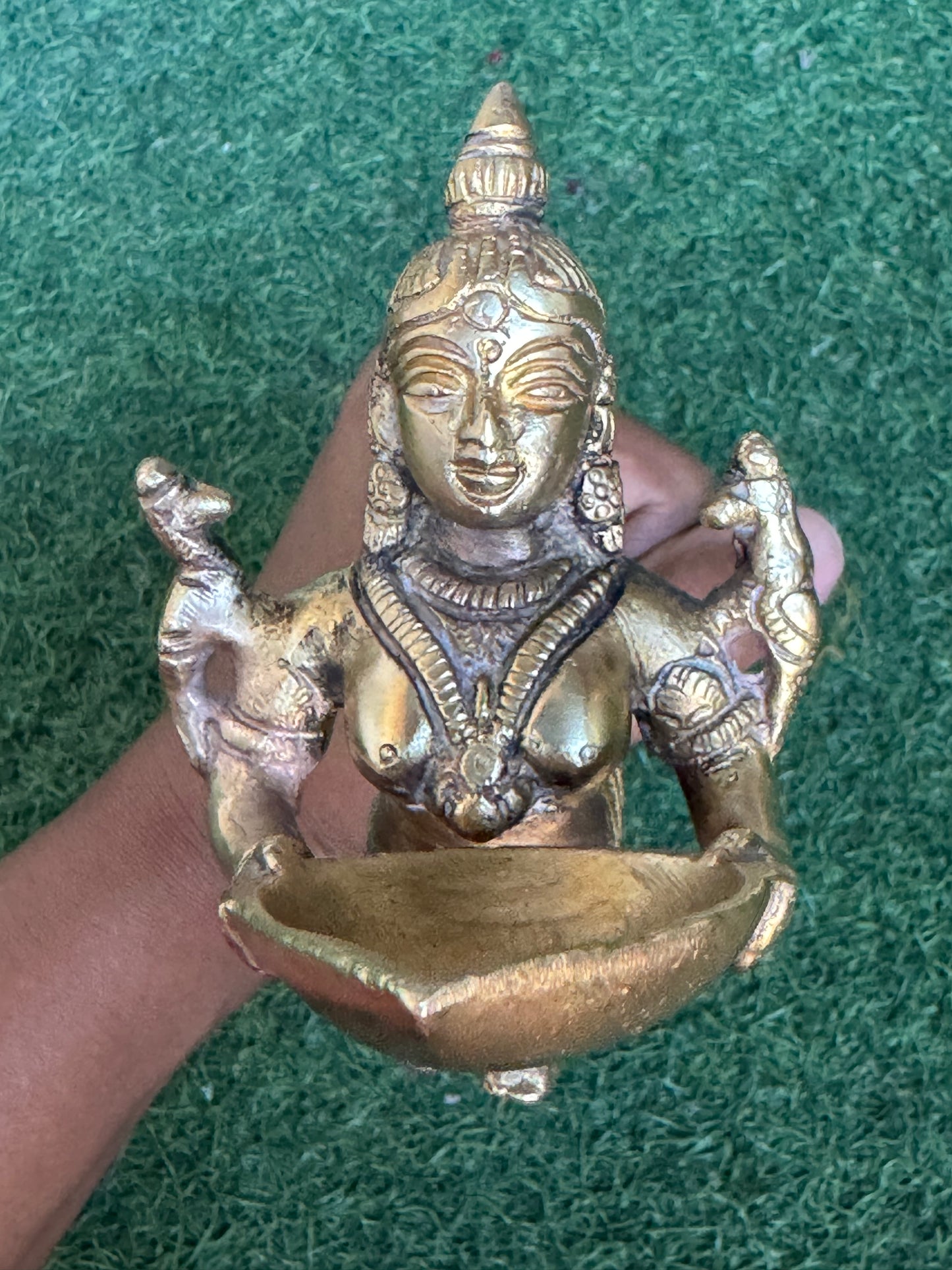 Lady holding Diya with long mermaid handle - handcrafted in brass