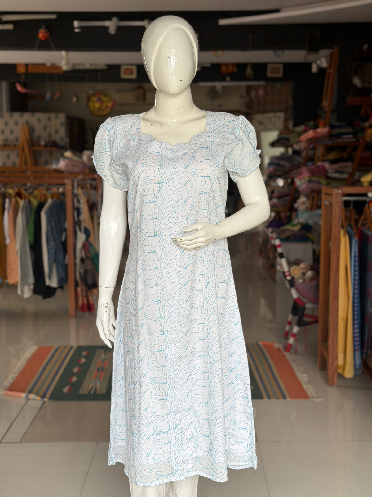 White A-line hand block printed soft cotton kurti with blue waves design