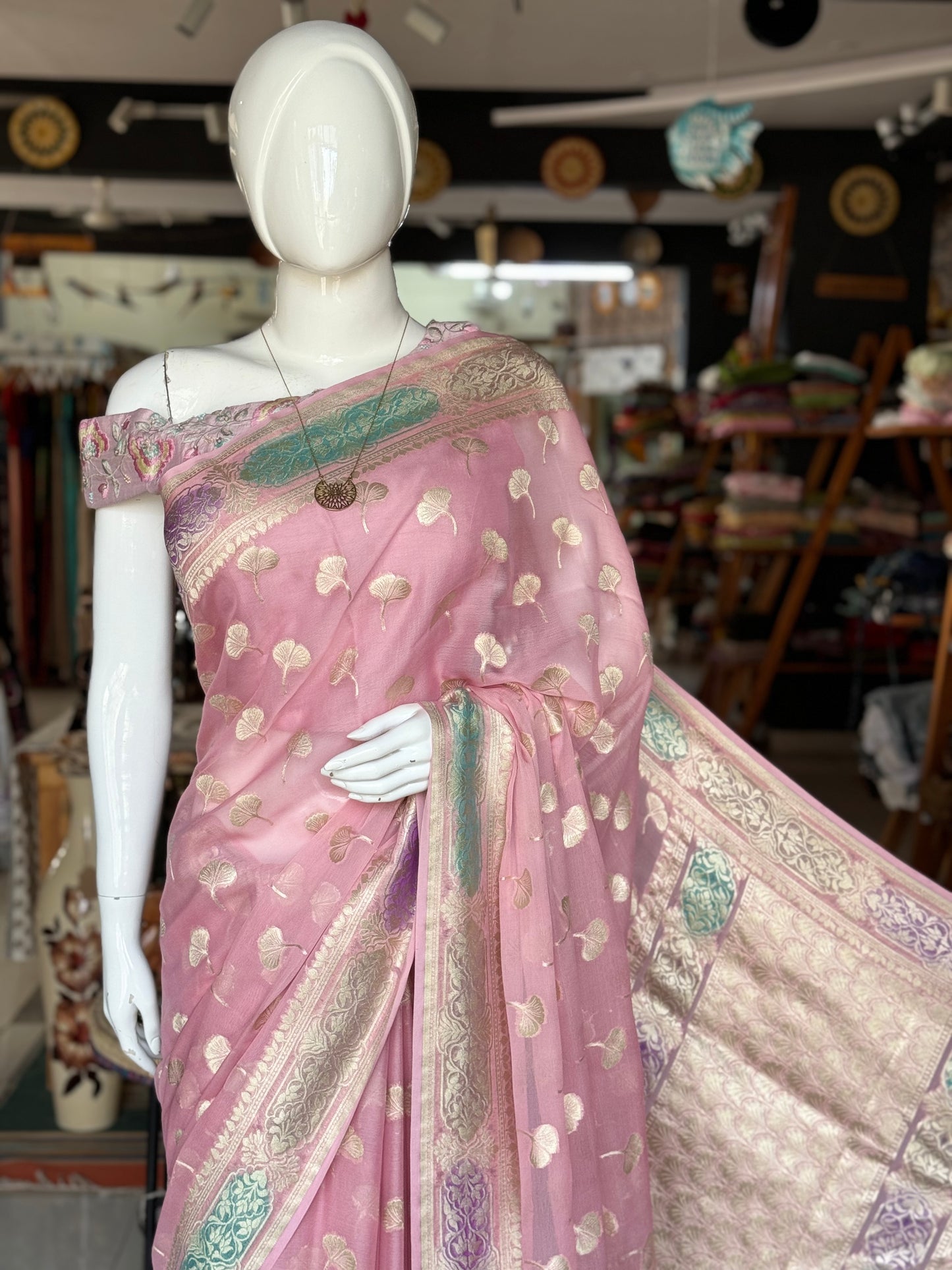 Light pink Banarasi georgette saree with colorful painted border