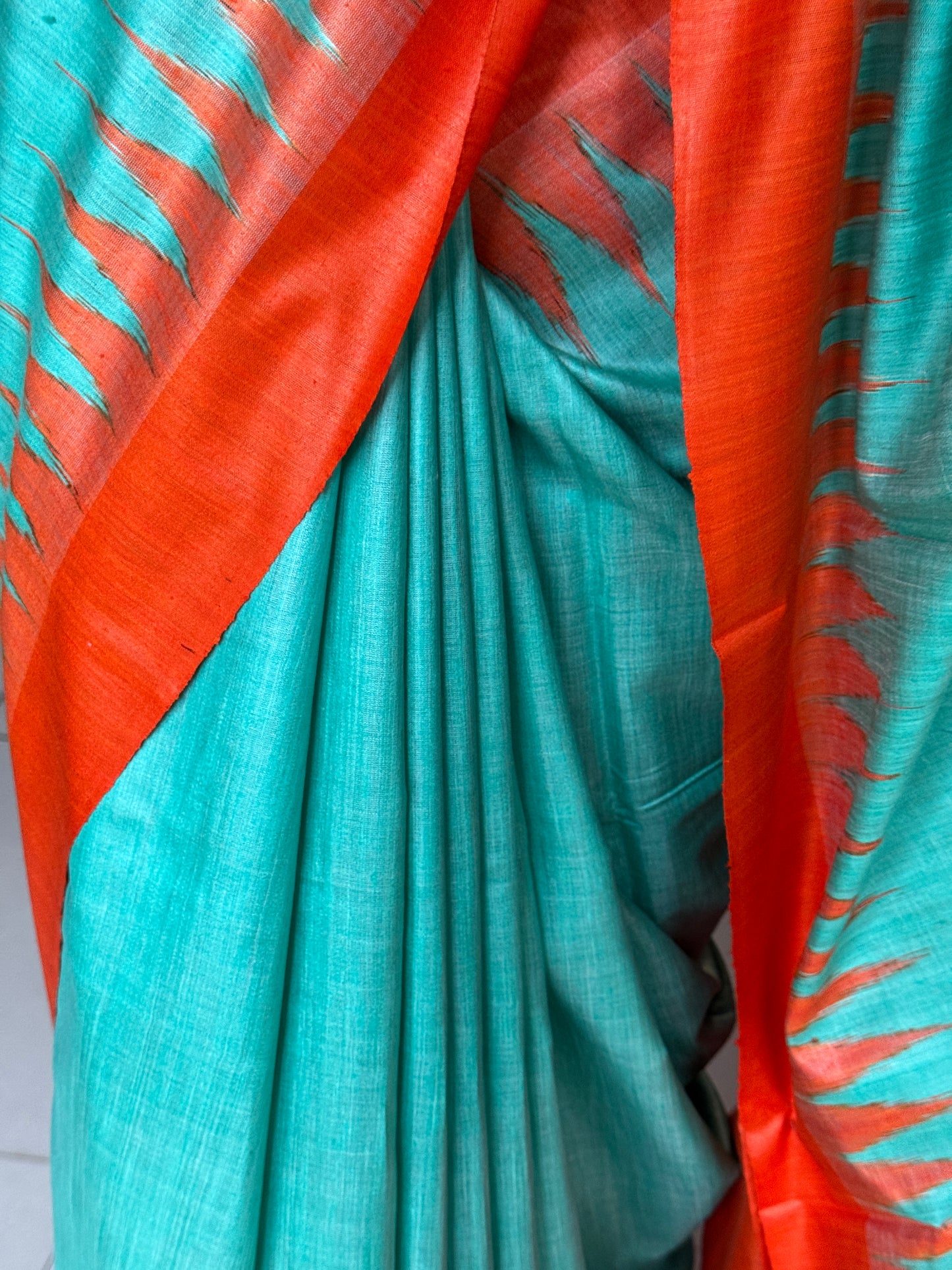 Sea green and orange tussar handwoven saree with ikat palla