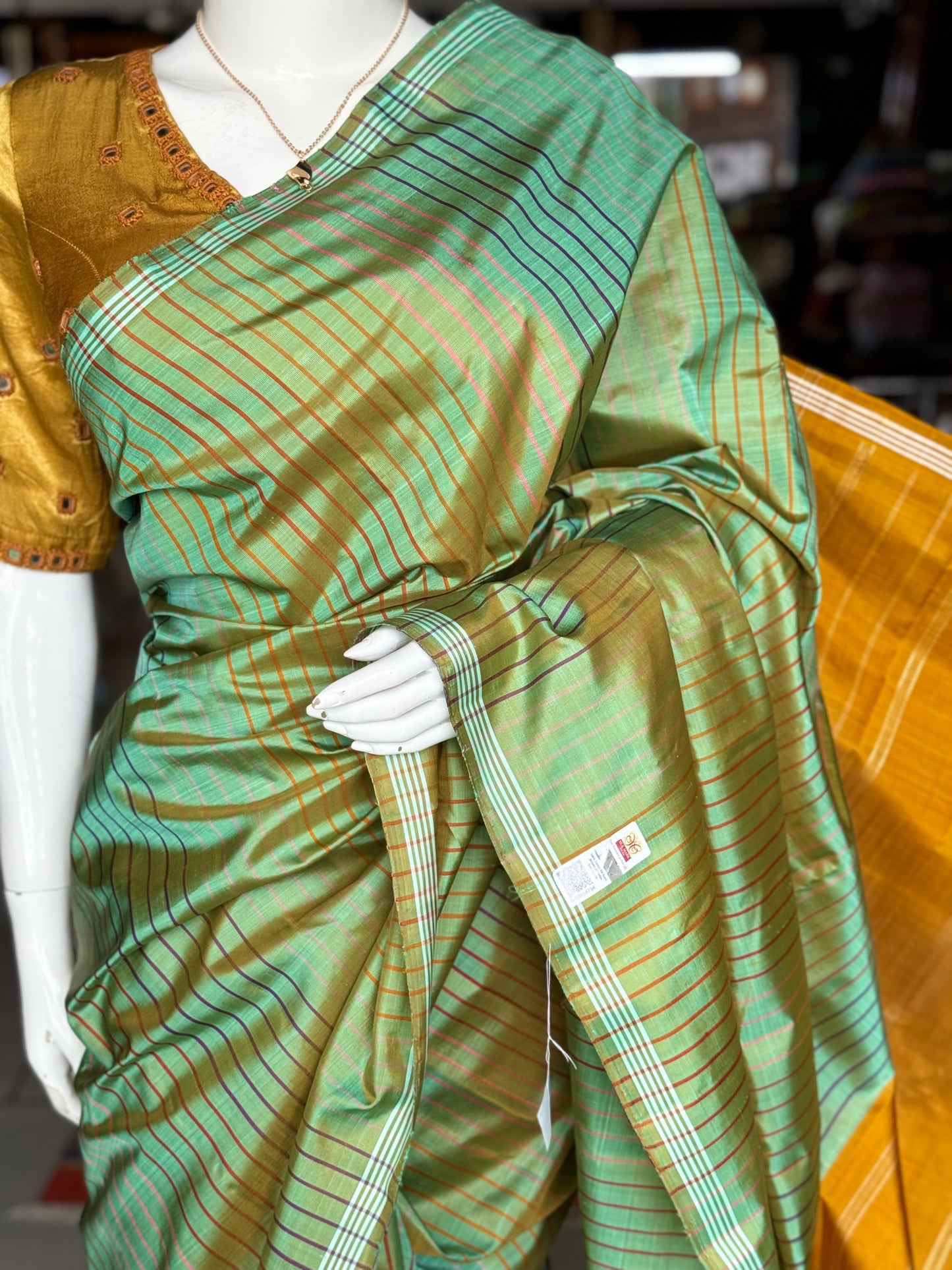 Green pure silk handloom kanjeevaram pattu saree with multi colored stripes all over