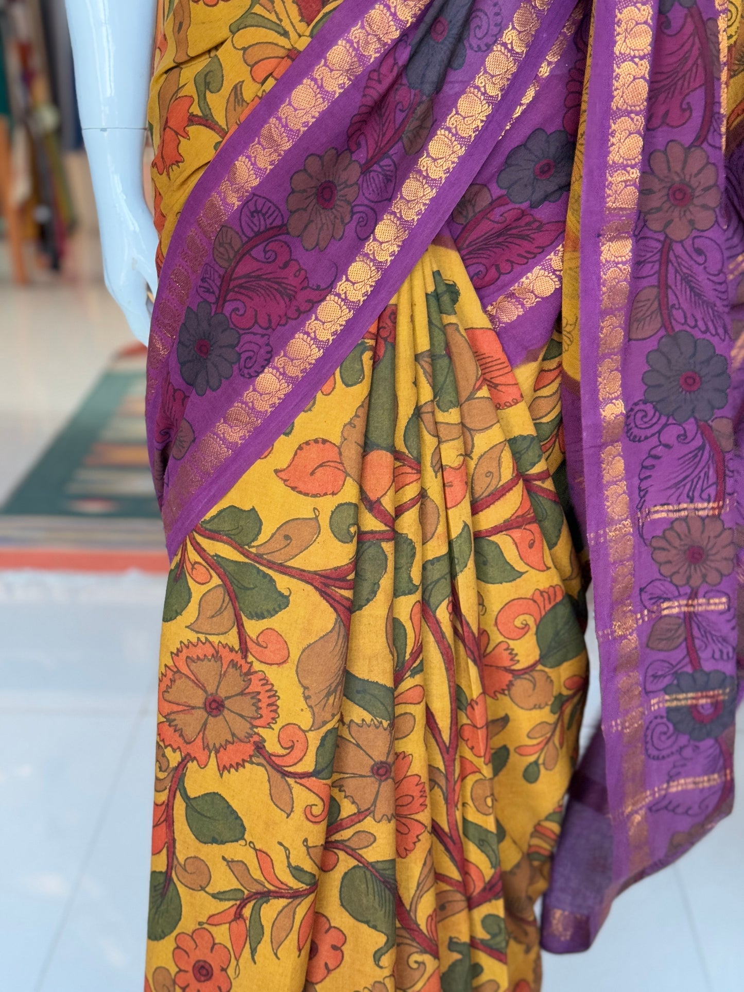 Mustard and purple floral design hand painted pen Kalamkari cotton saree