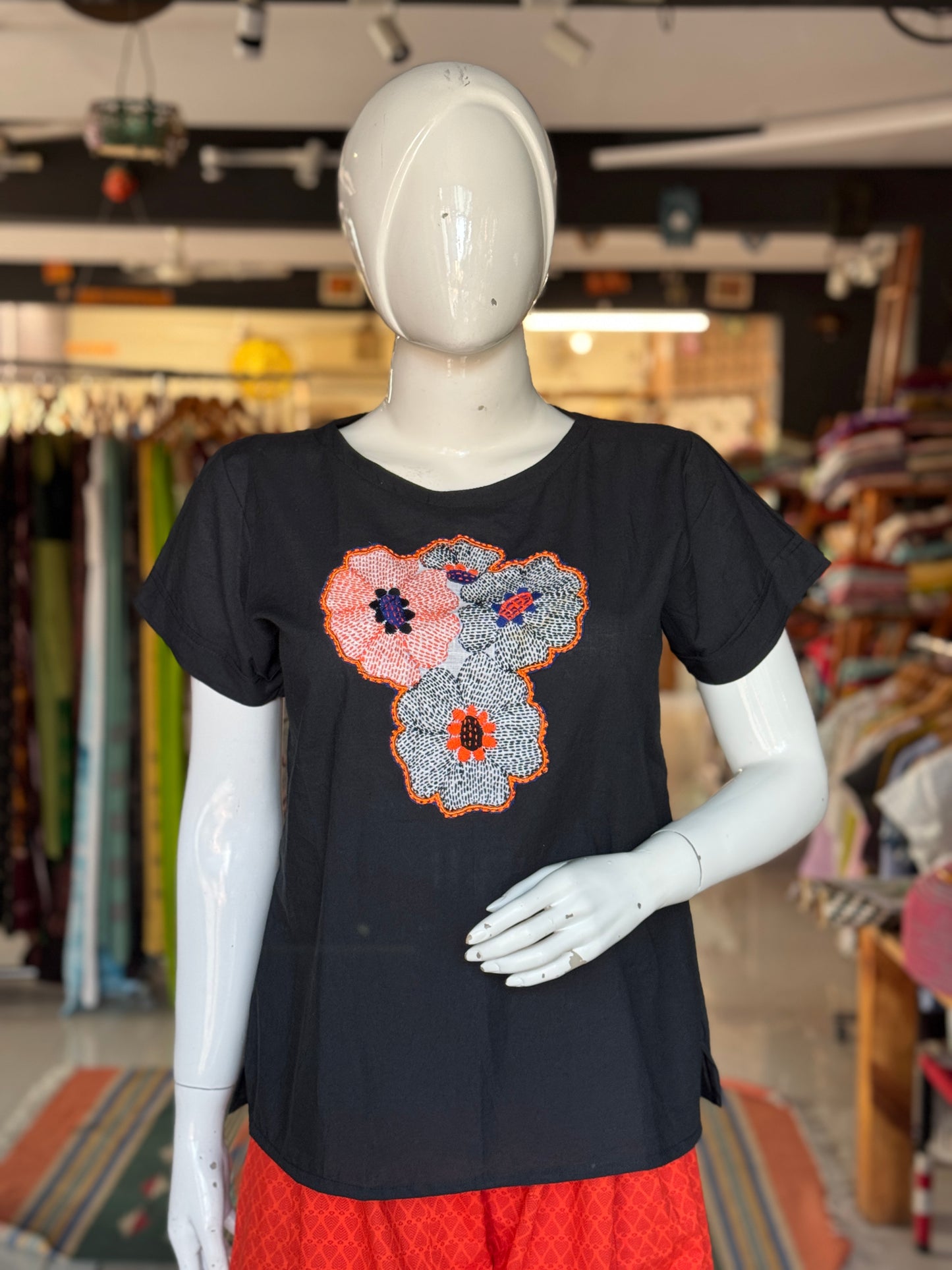Black cotton top with hand embroidery on the front