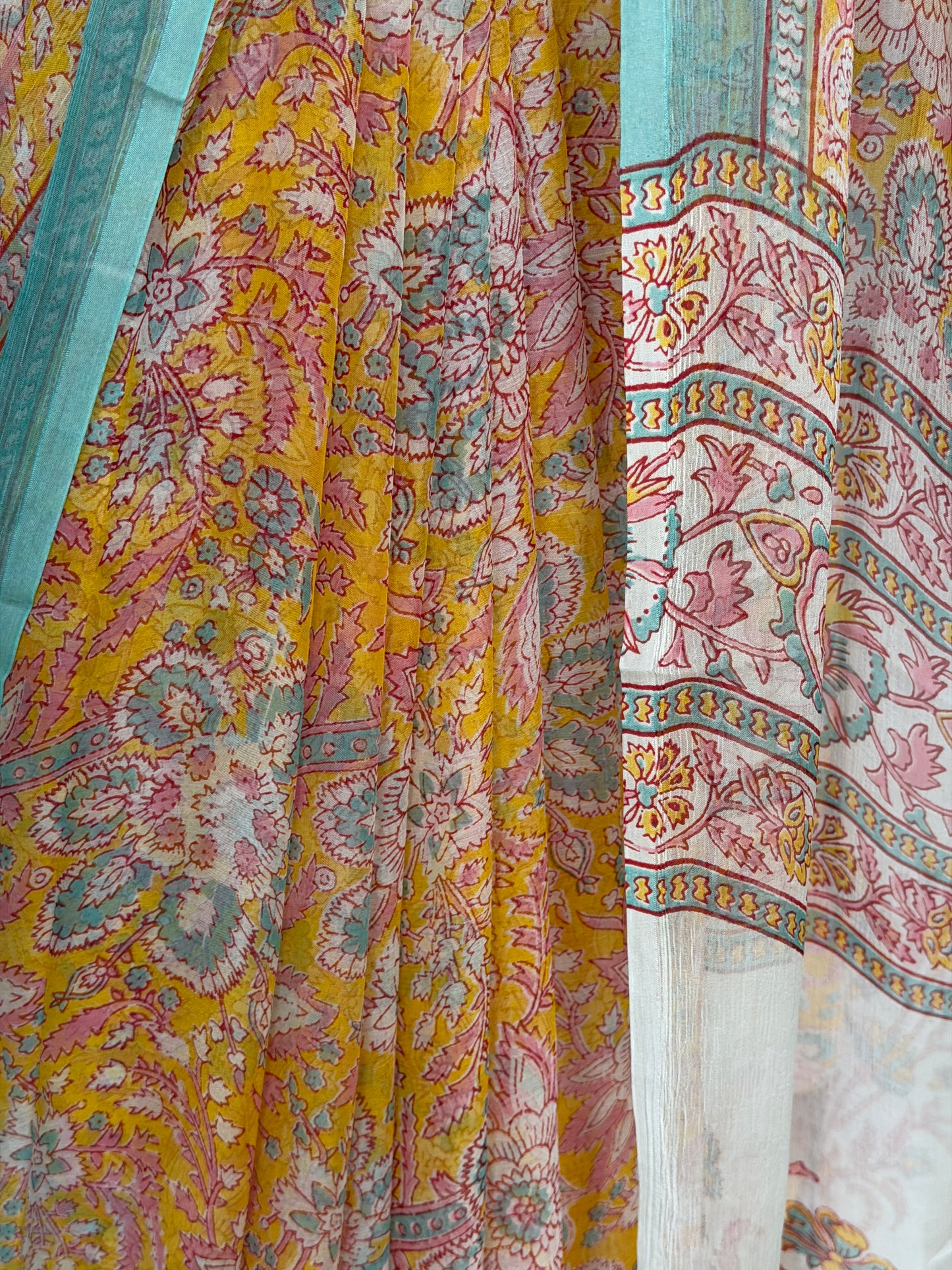 Mustard yellow Chiffon floral printed saree with teal border