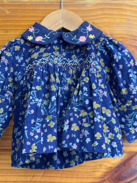 Bright blue floral print Corduroy soft frock with peter pan collar and smocking embroidery