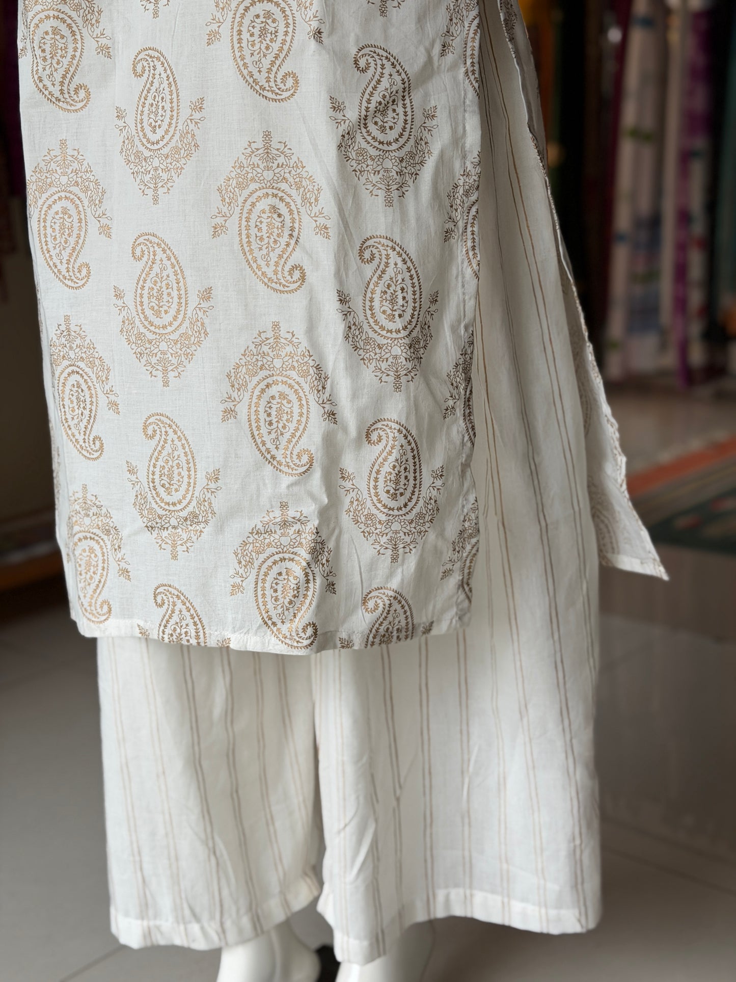Off white paisley print cotton kurti paired with a matching stripes print barrel pants - 2 piece set