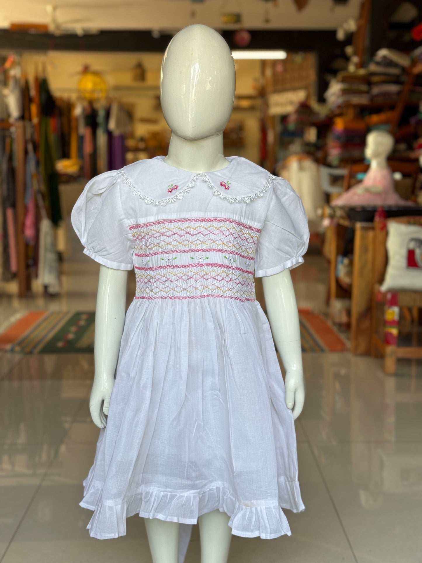White hand embroidered smocking cotton frock for girls with collar and frills at hem