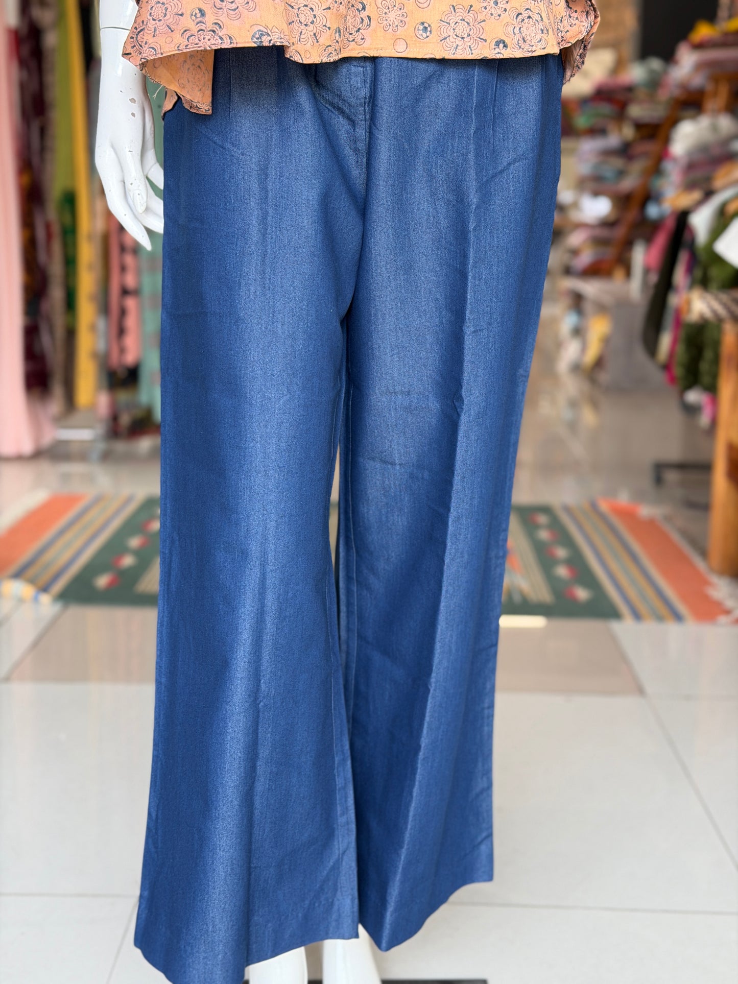 Blue cotton denim pleated pants with buttons detailing