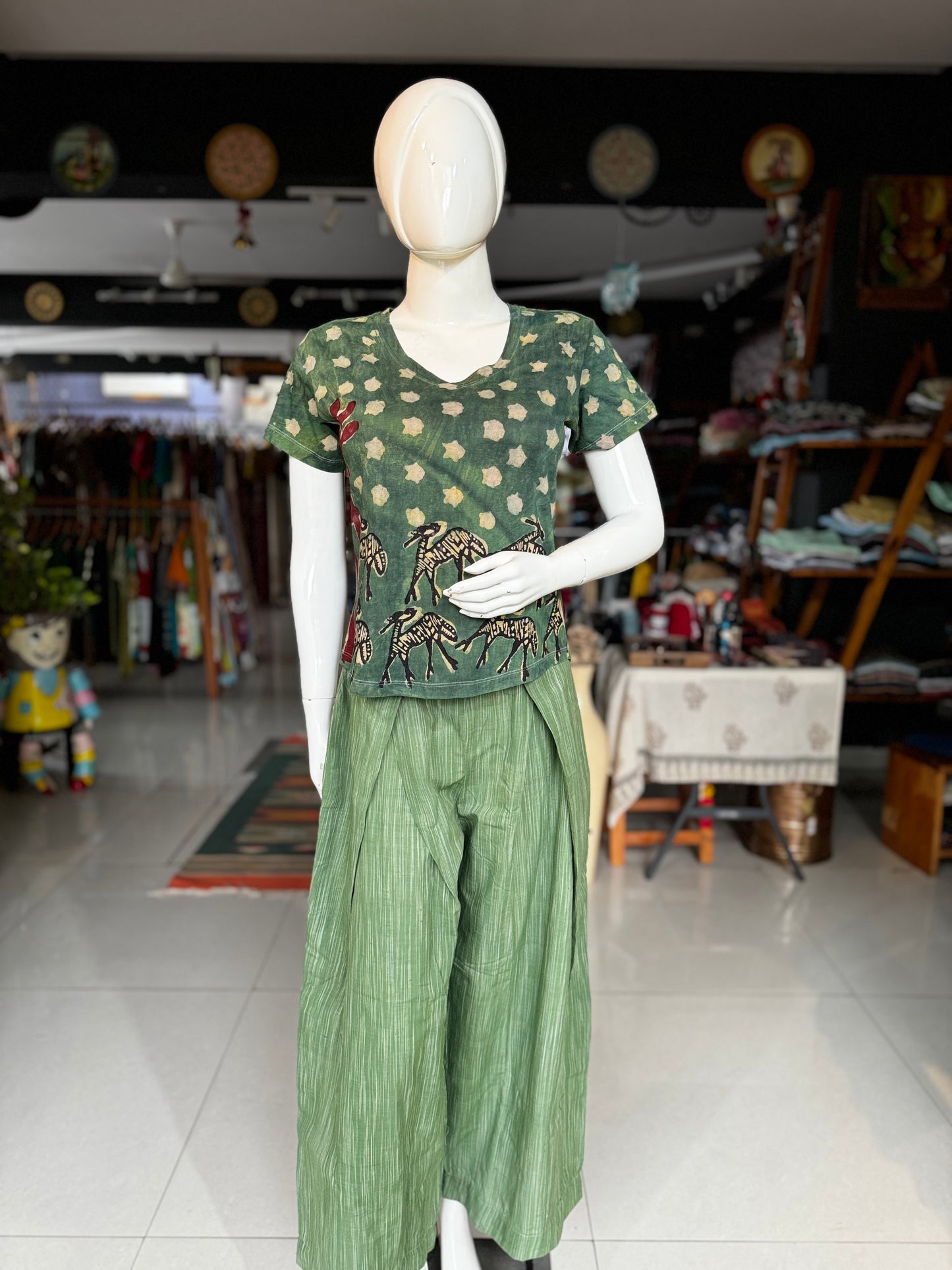 Green handloom cotton flared pants with pleats at waist detailing