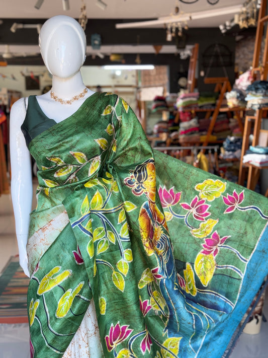 Off white and green hand painted Batik pure katan silk saree - lady with flowers on pallu