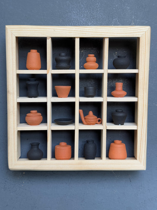 Miniature handcrafted clay pots in a wooden shelf - 6 x 6 inch frame size