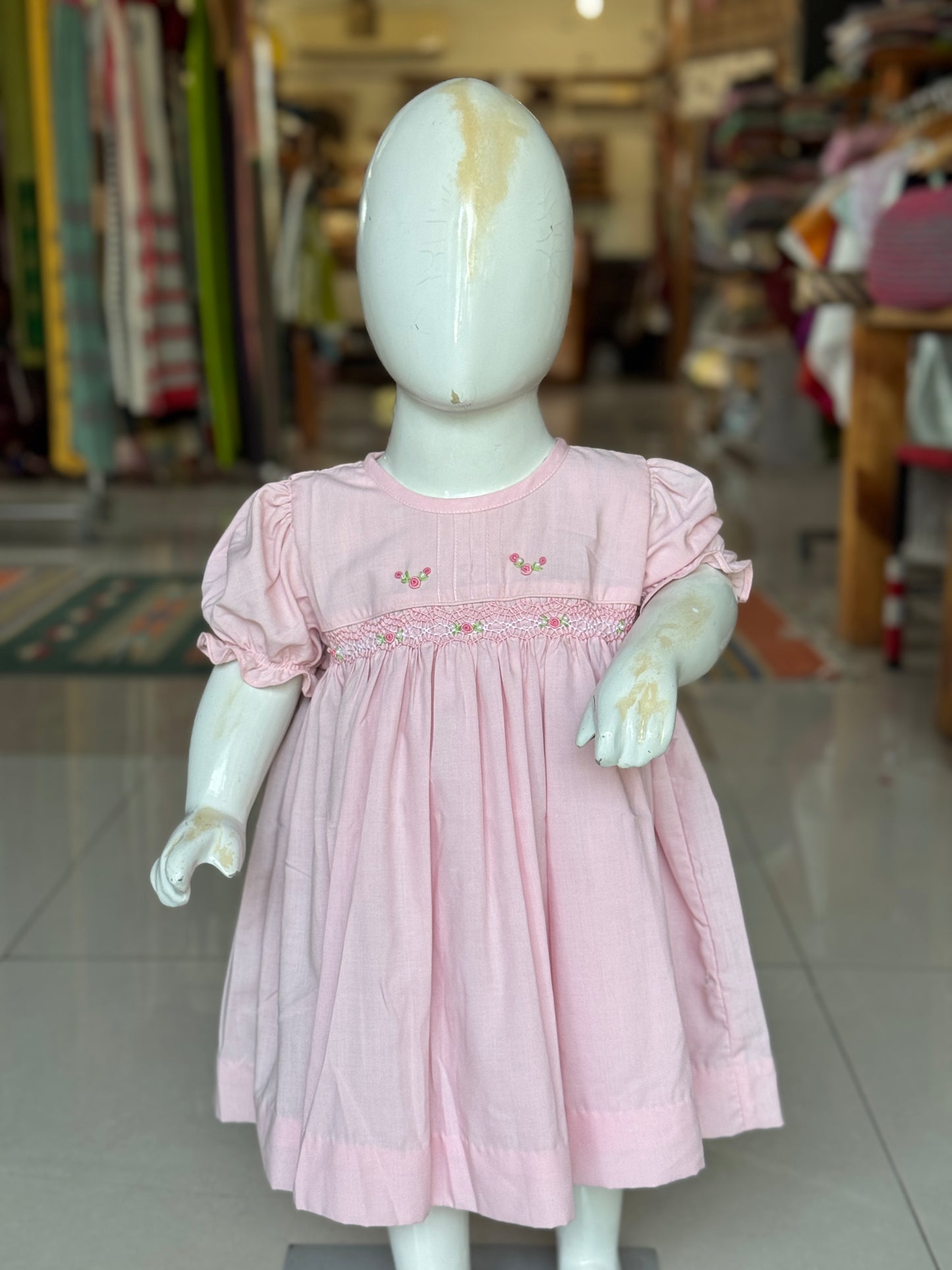 Light pink hand embroidered smocking cotton frock for girls with pintucks at neck