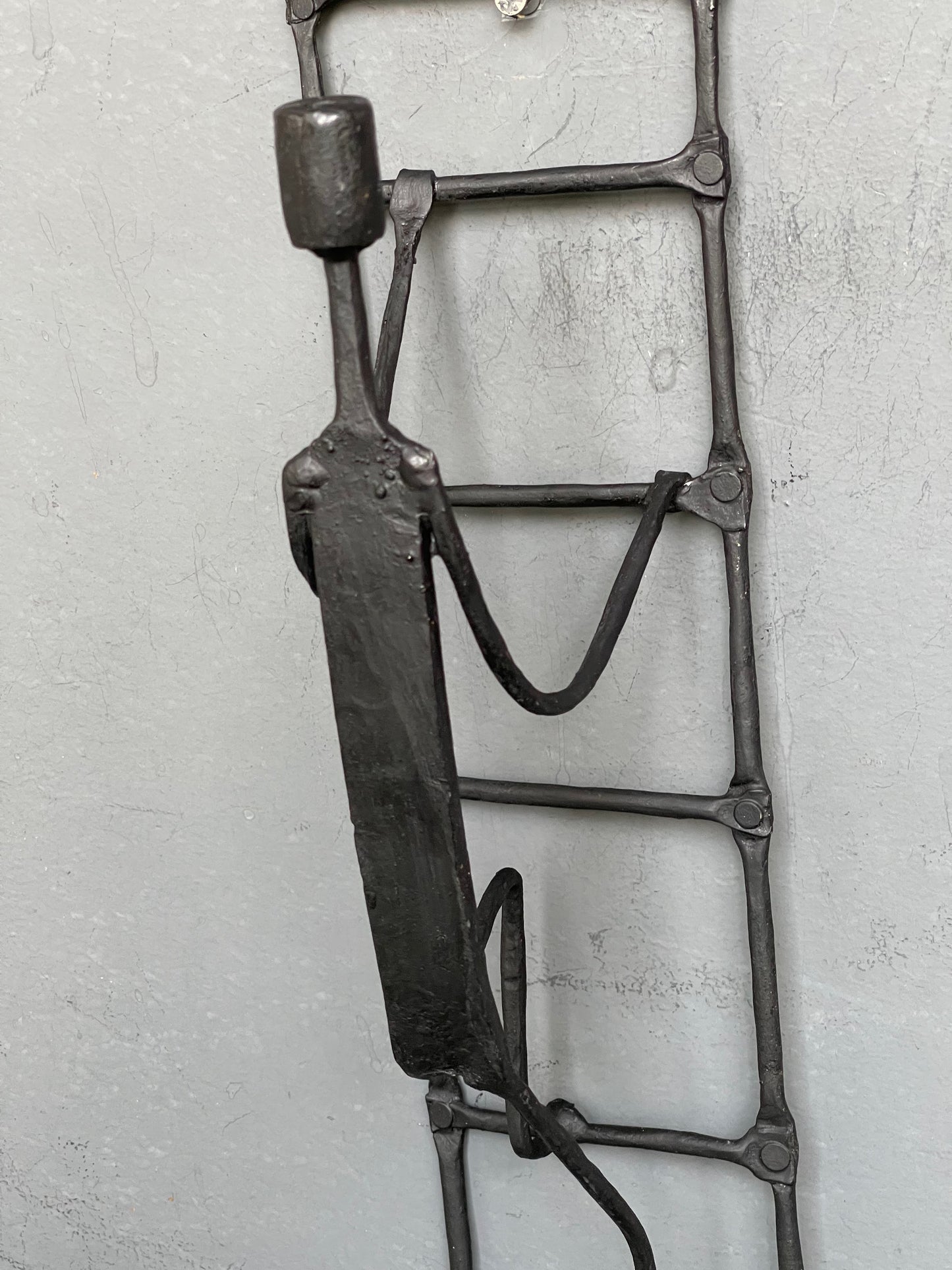 Person climbing ladder - handcrafted wrought iron