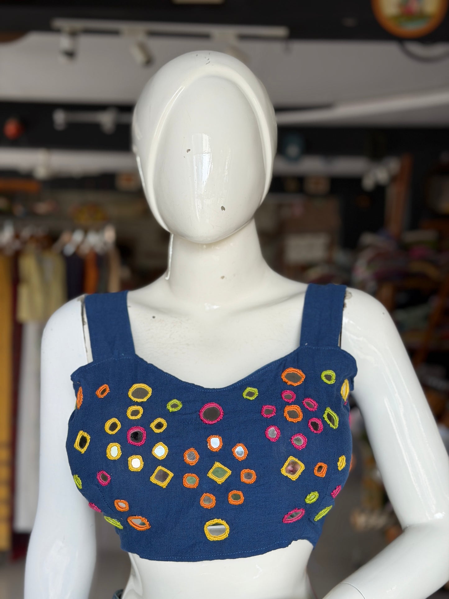 Navy blue kala cotton sleeveless blouse with all over colorful mirror work on front and back with adjustable width back
