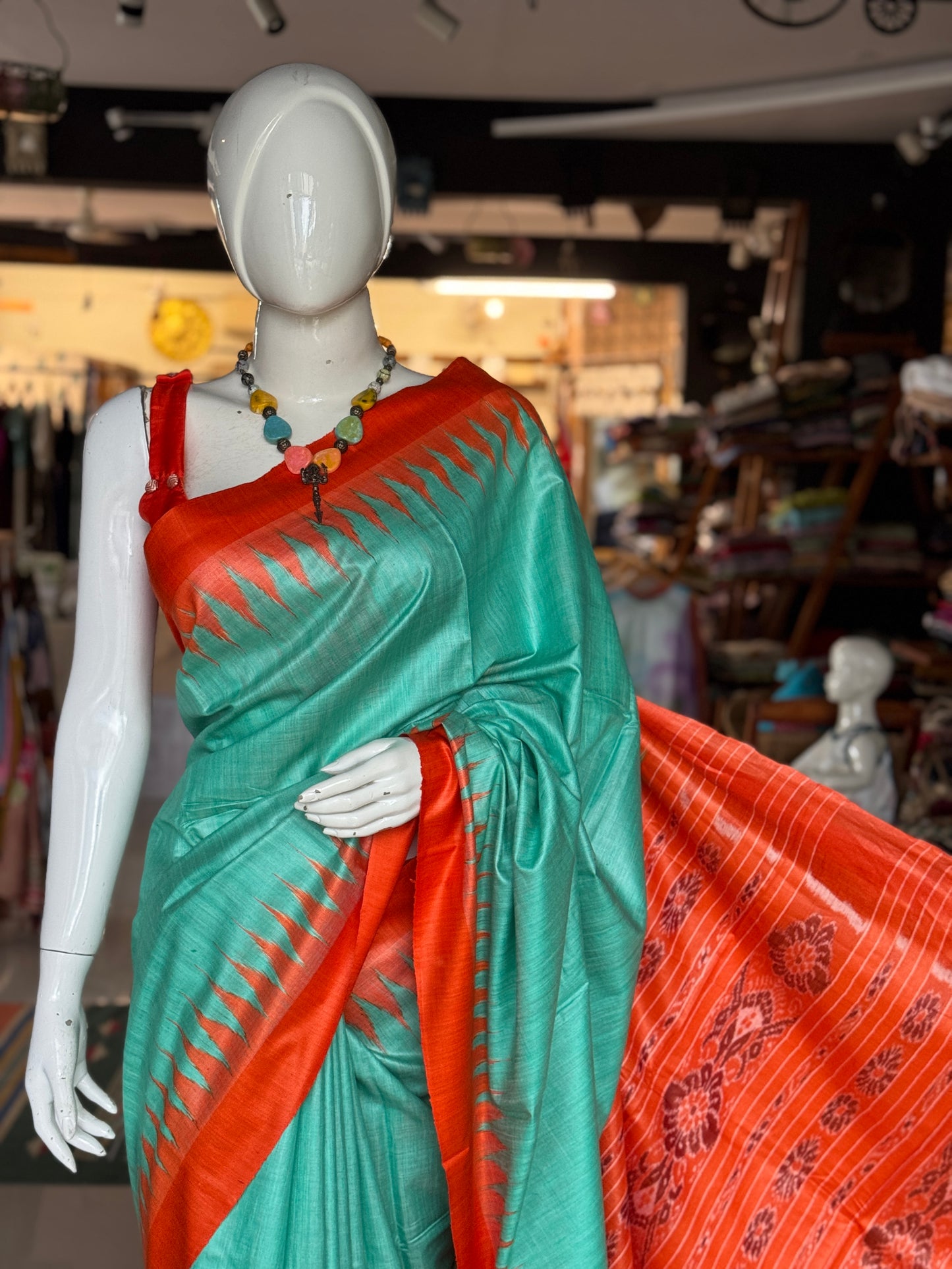 Sea green and orange tussar handwoven saree with ikat palla