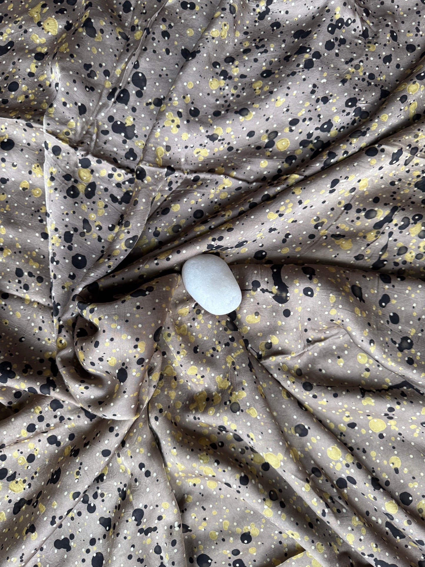 Greyish brown modal Ajrakh hand block print fabric with black and green splashes on it