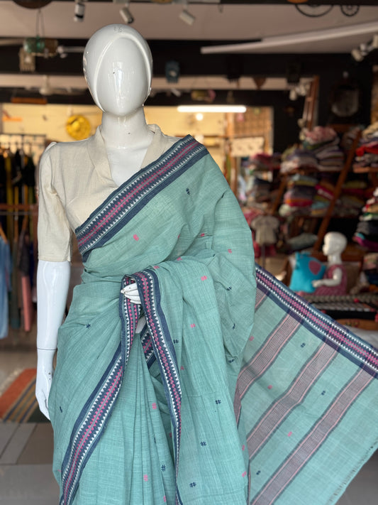 Pastel bluish green coarse textured handloom cotton saree with small butis and thread border