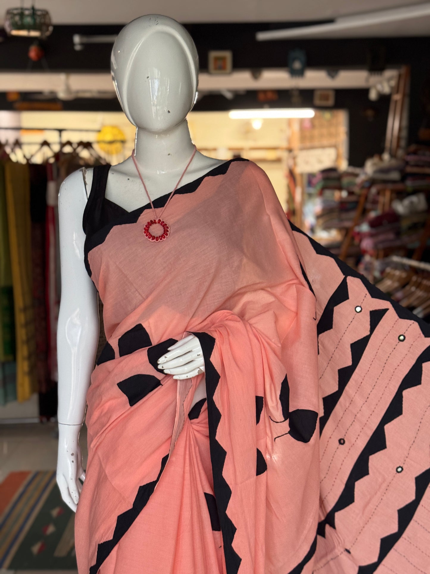 Peach soft cotton saree with black leaves Applique patches and mirror embroidery