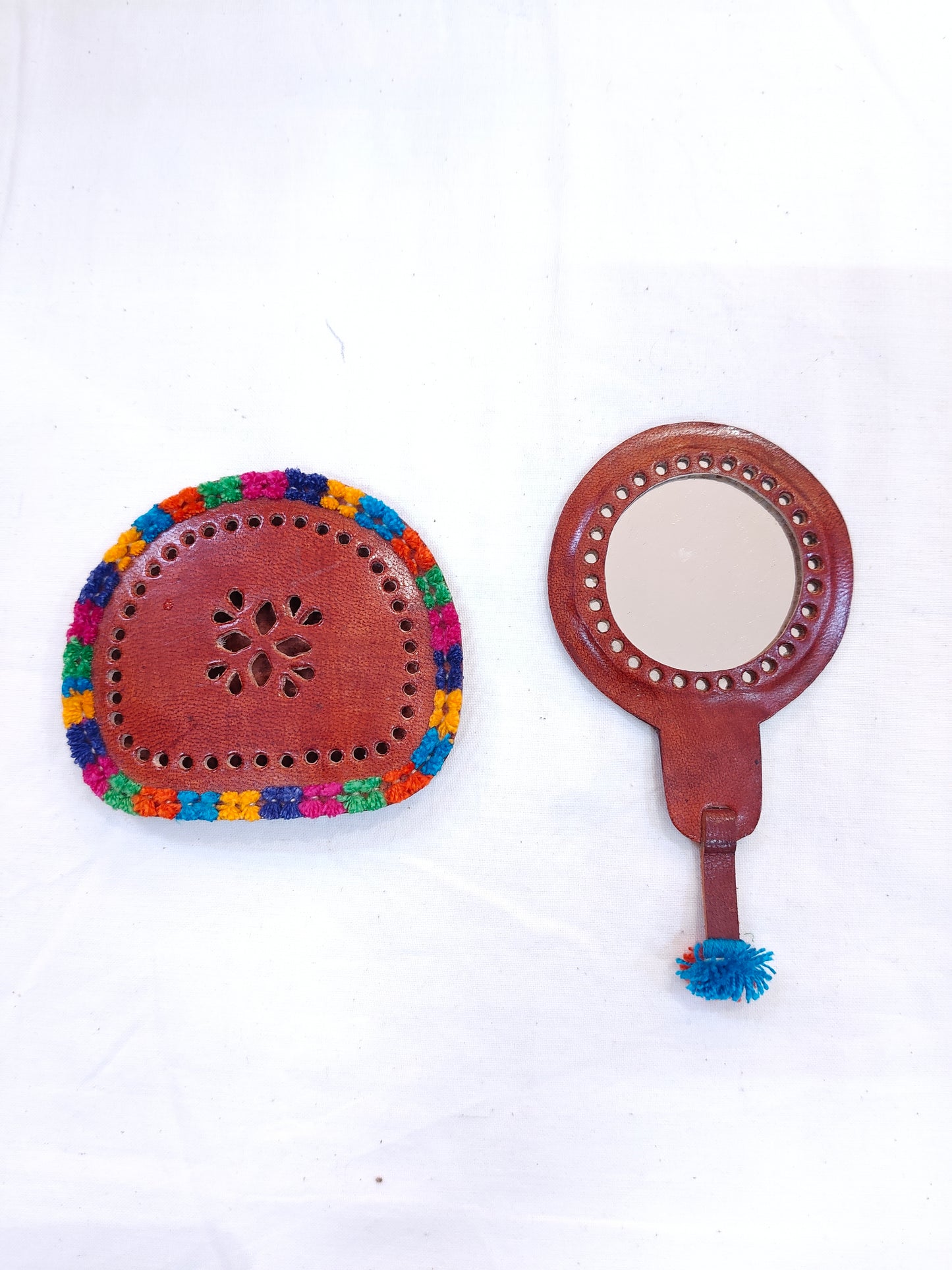 Mirror in hand crafted leather cover with handle - carry along in your hand bag