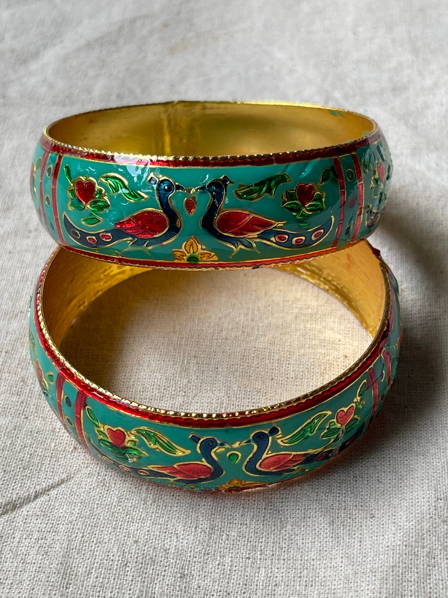 Lacquer enamel bangles pair with peacock motifs