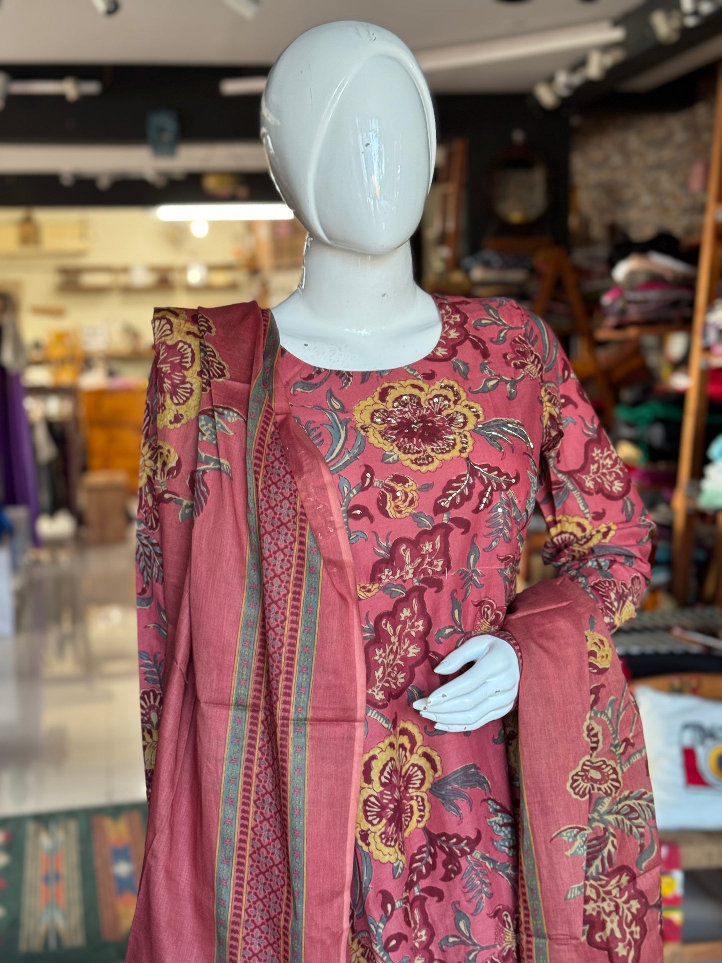 Coral rust tone floral print cotton flared umbrella style Kurti, pants and dupatta set