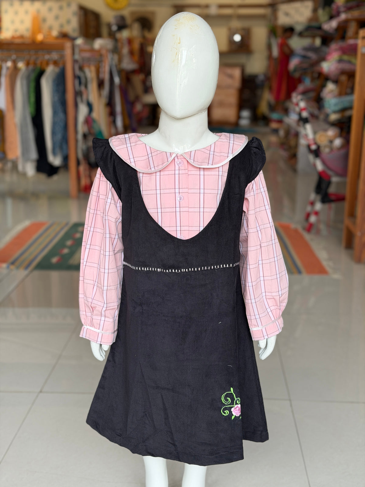 Black corduroy pinafore dress with pink checks collared shirt for girls