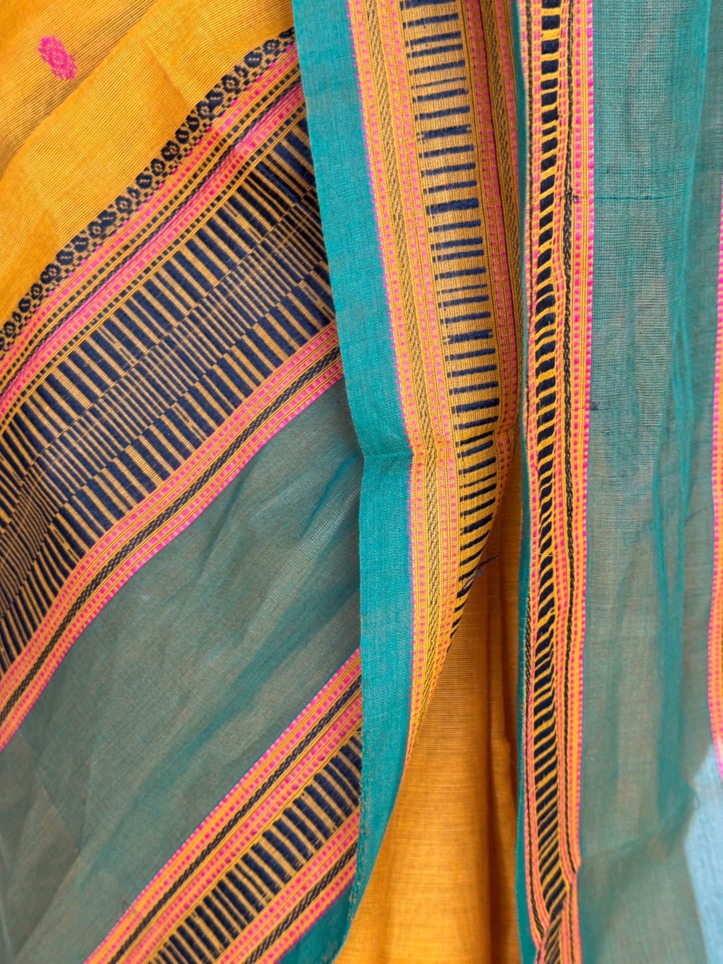 Mustard yellow and green Chettinad cotton handloom saree with butis all over and wide borders