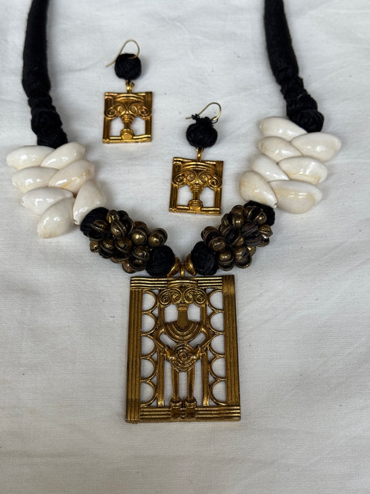 Brass Dokra neckpiece with shells, ghungroo and black thread - matching dokra earrings set