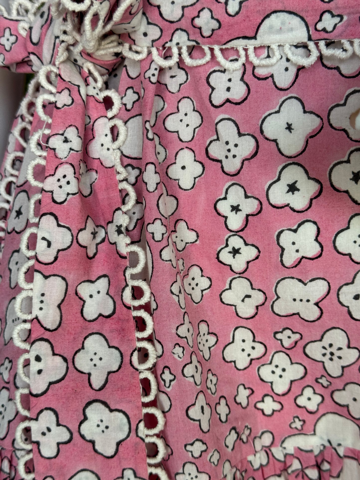 Pink cotton hand block printed tiered dress with belt and lace detailing