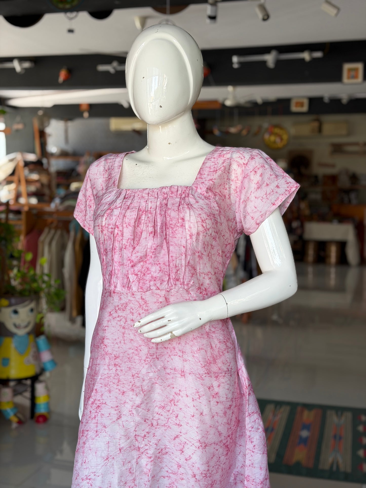 Pink batik dress with square neckline and gathered bust