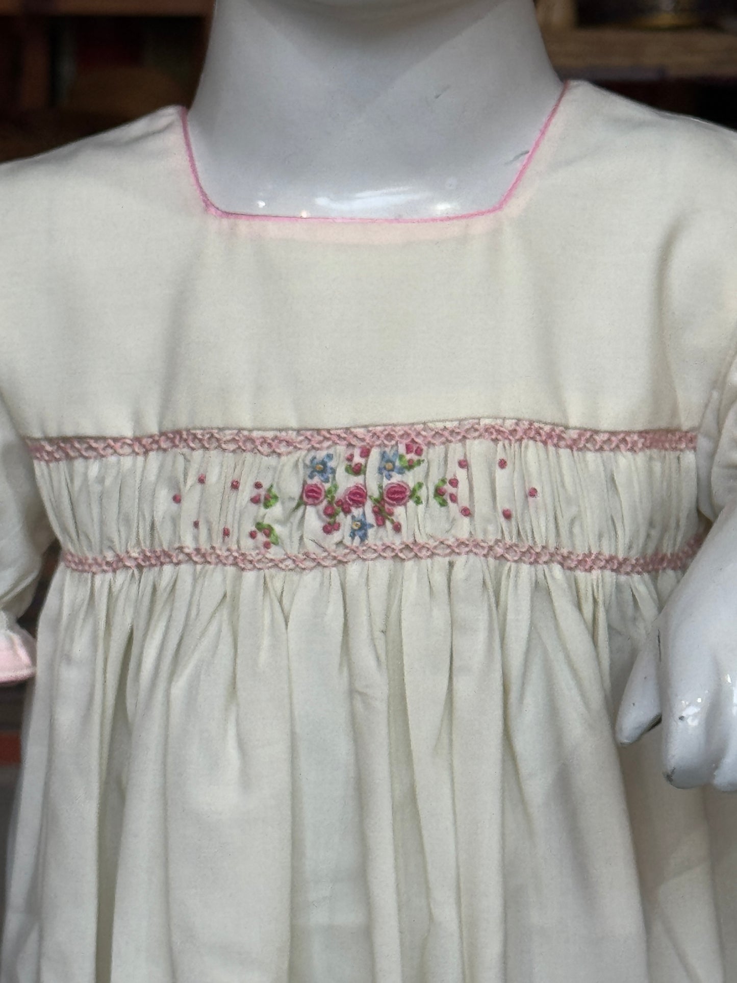 Cream smocking square neck cotton frock with hand embroidery and pink trims