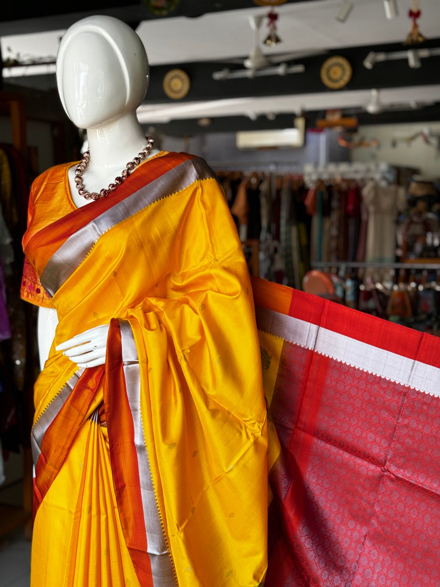 Haldi yellow pure silk Kodiyala handloom saree with all over gold butis and silver katan border